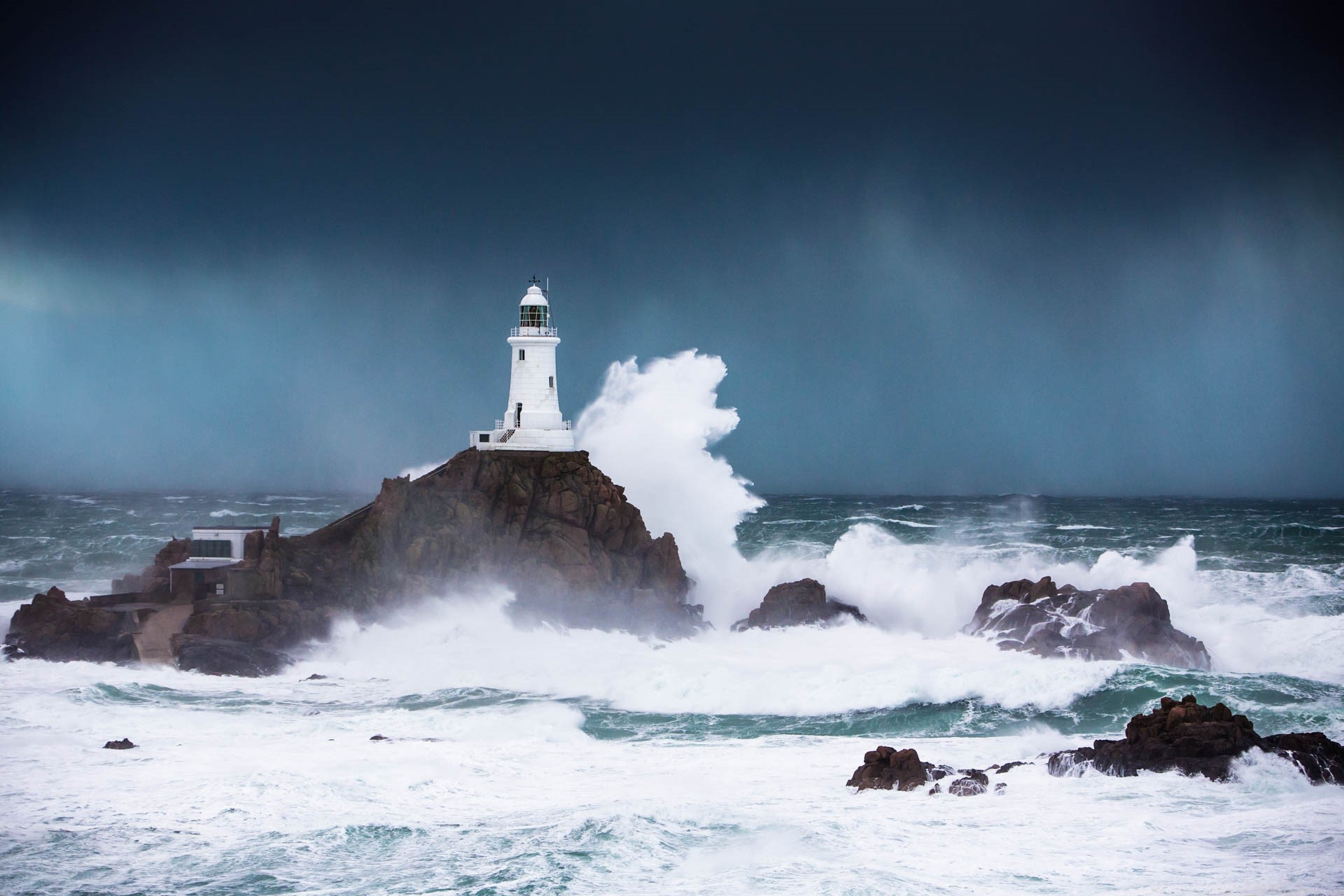 Corbiere Lighthouse surrounded by stormy winter seas