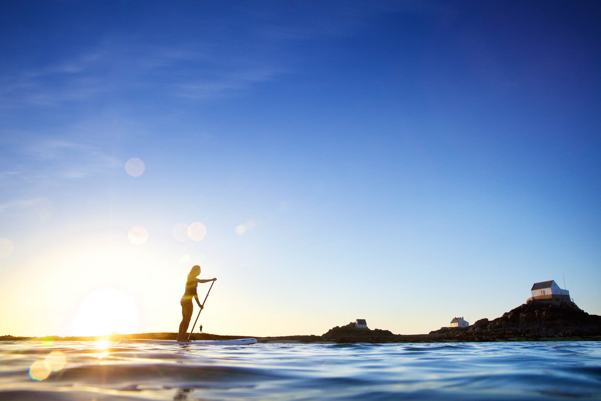 Paddle Boarding at Les Ecrehous in low Sunlight